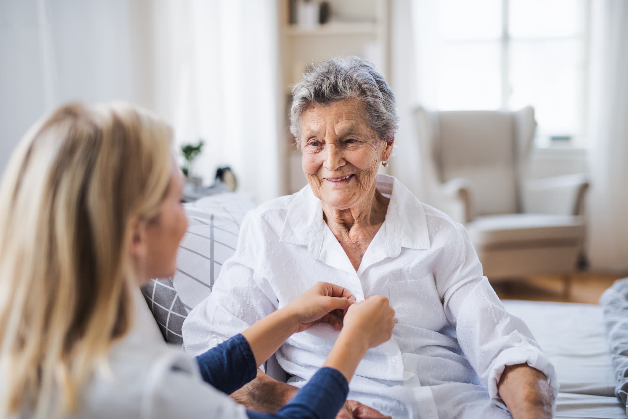 Caregiver assisting elderly client in Phoenix