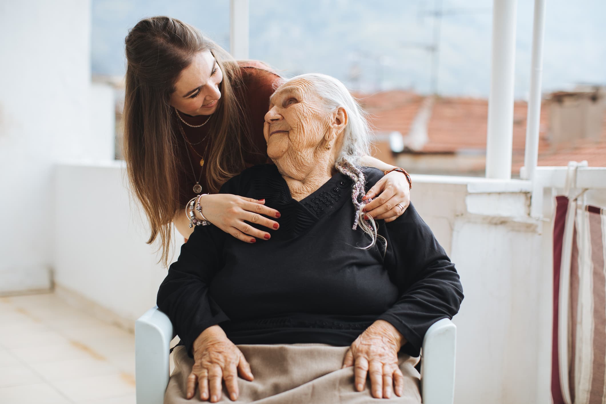 Caregiver assisting elderly client in Seattle